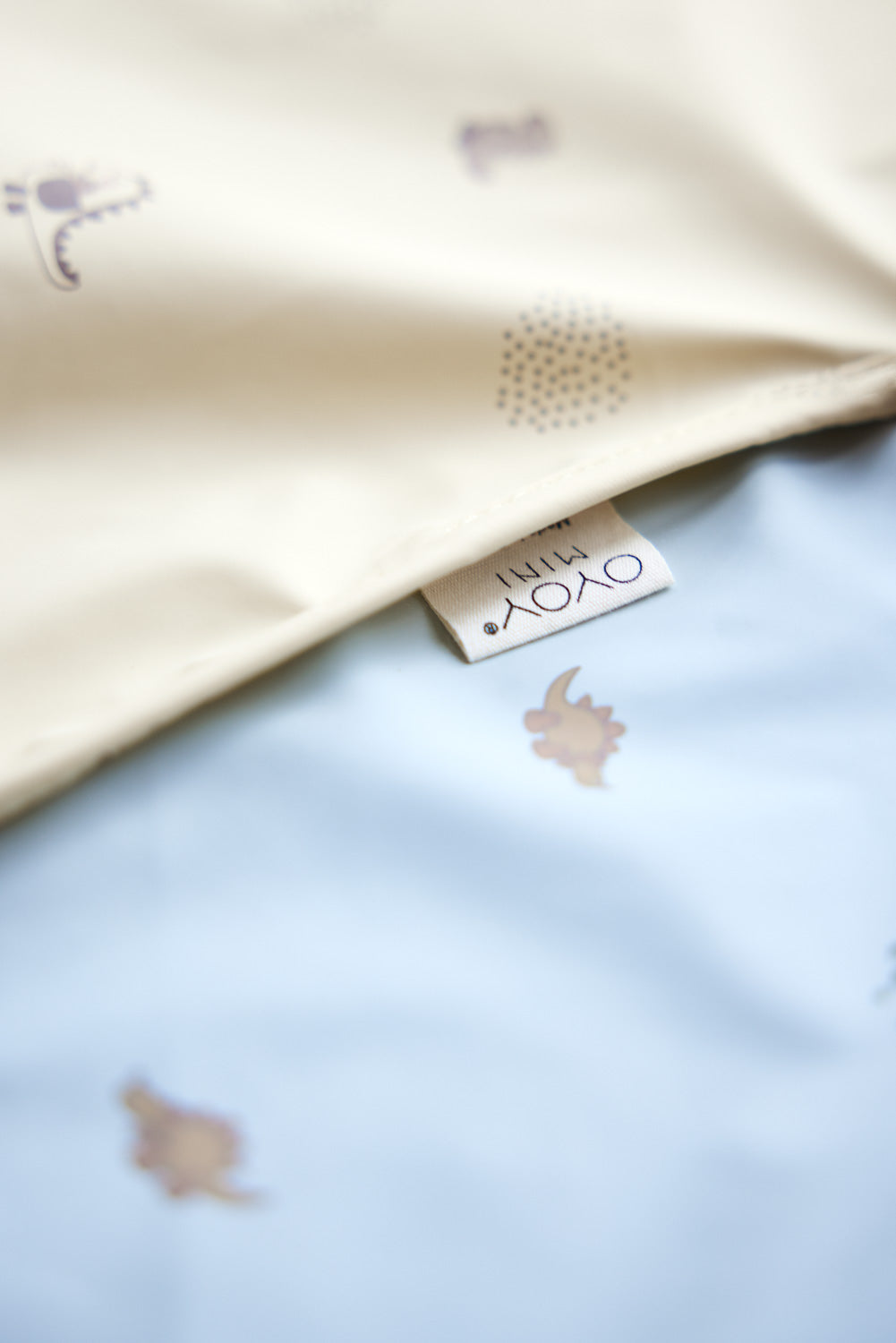 Dino Cape Bib in Dusty Green