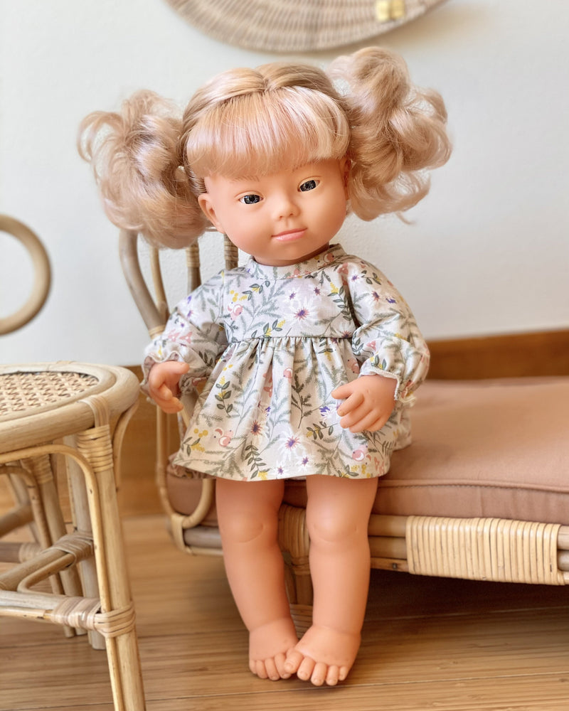 blonde down syndrome baby doll.