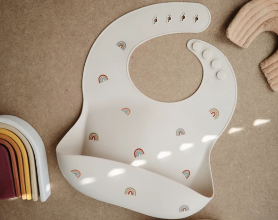 Silicone Baby Bib - Rainbows feeding Mushie
