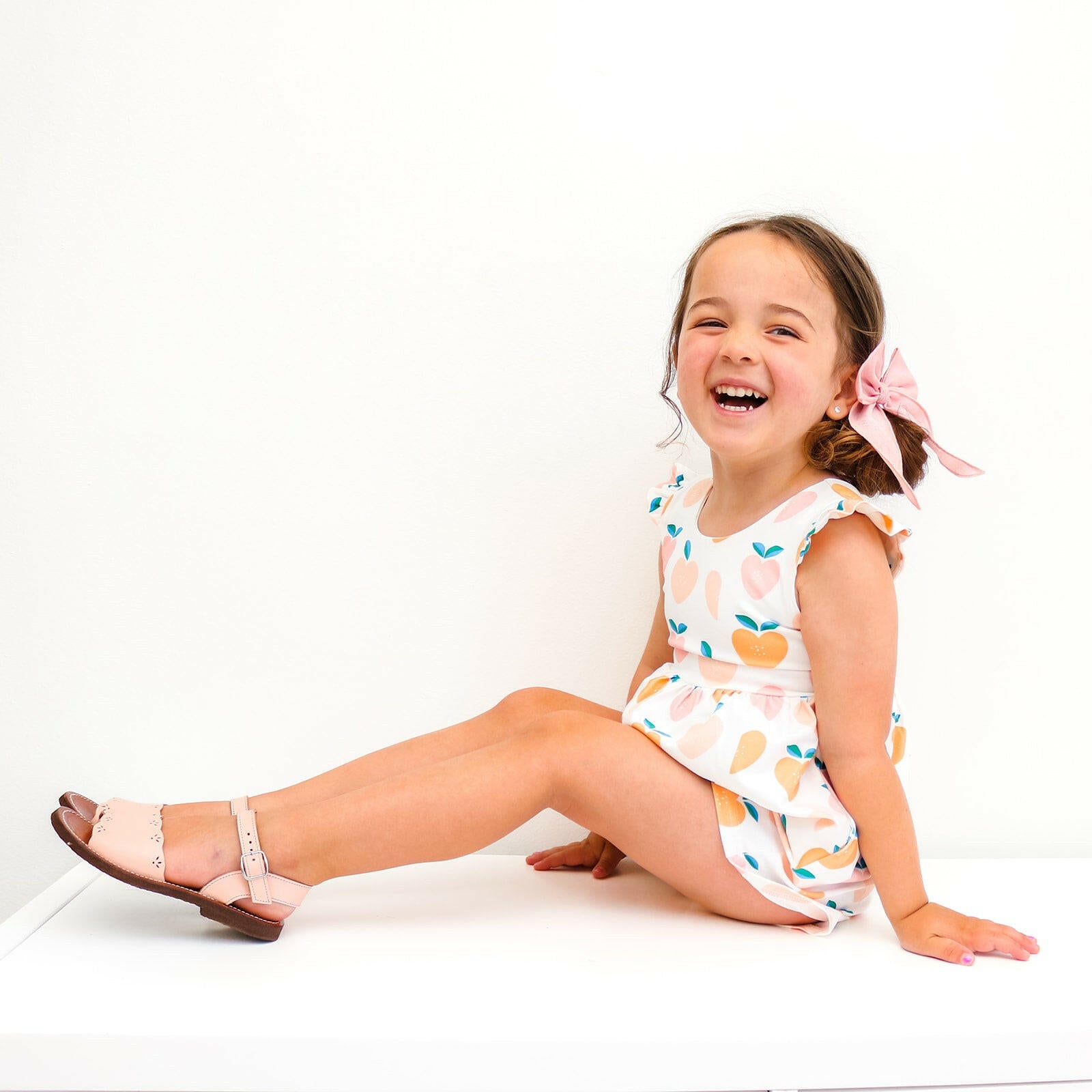 Macie Romper in Sweet Peach Ollie Jay