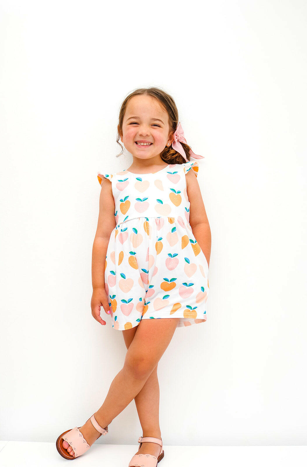 Macie Romper in Sweet Peach Ollie Jay