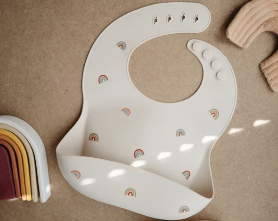 Silicone Baby Bib - Rainbows feeding Mushie   