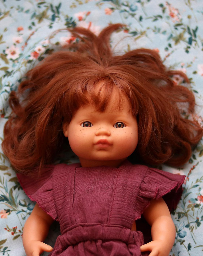 Red top headed doll